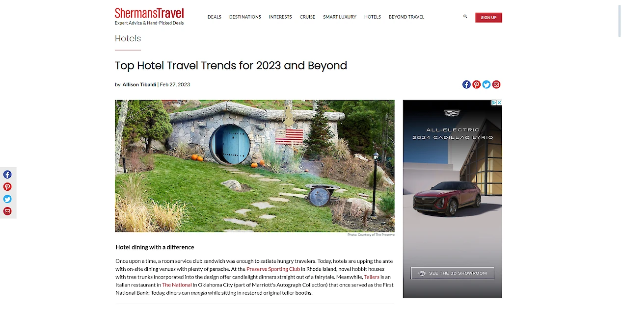 Image shows a travel website article titled "Top Hotel Travel Trends for 2023 and Beyond" with a picture of a unique, hobbit-like hotel.